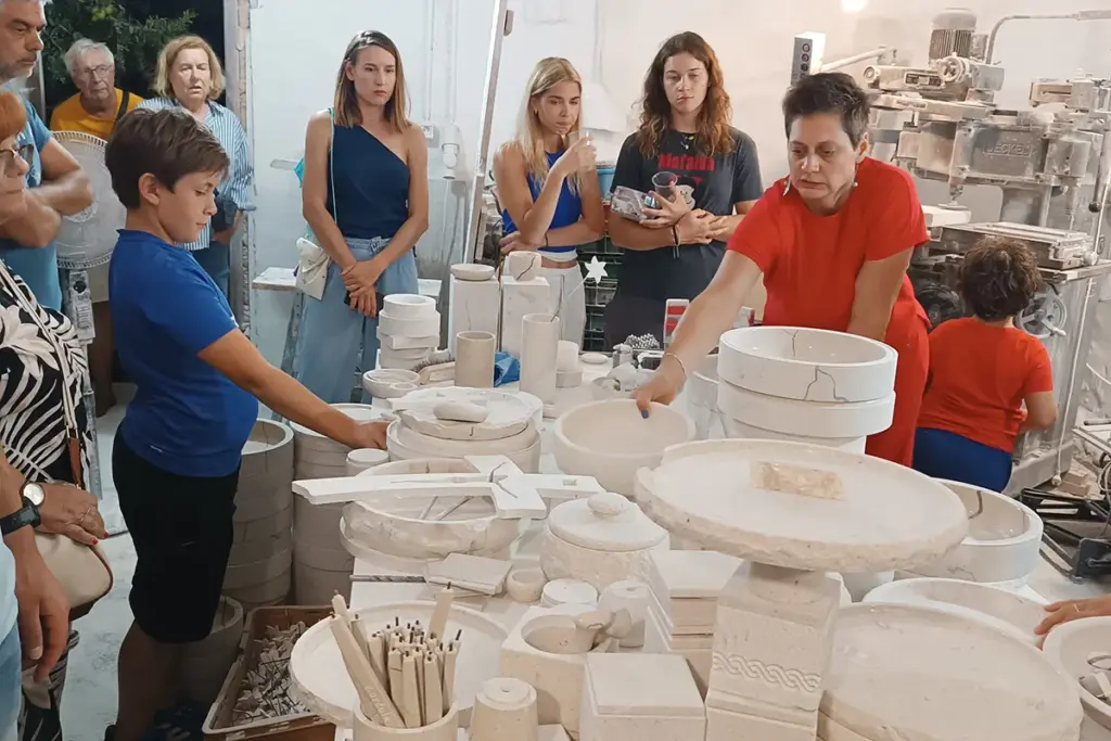 Visitors exploring handcrafted Brač stone products and learning about traditional stonemasonry at the Kameni otok workshop