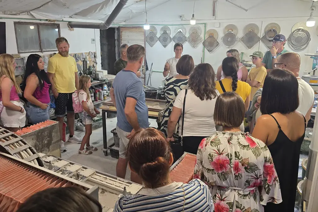 Visitors watching a machinery demonstration during the Journey Through Stone experience at the Kameni otok workshop on Brač