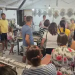 Visitors watching a machinery demonstration during the Journey Through Stone experience at the Kameni otok workshop on Brač